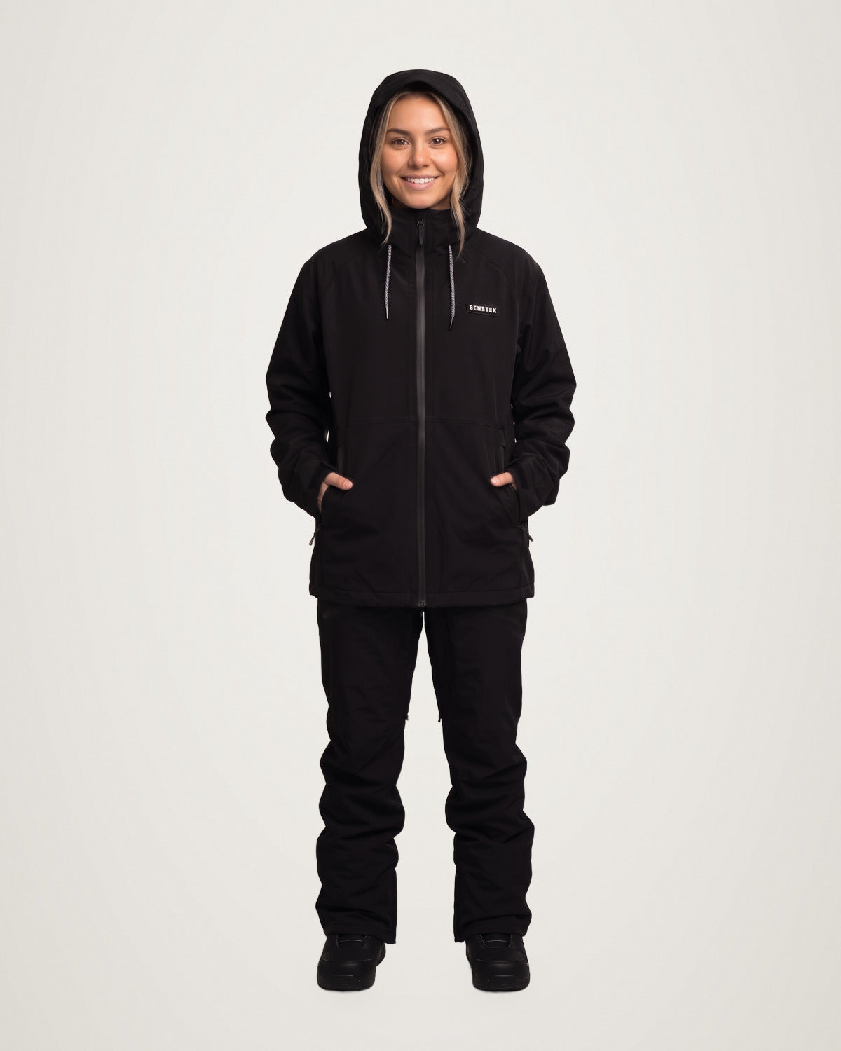 Sarah in the black Focus Jacket with the hood up